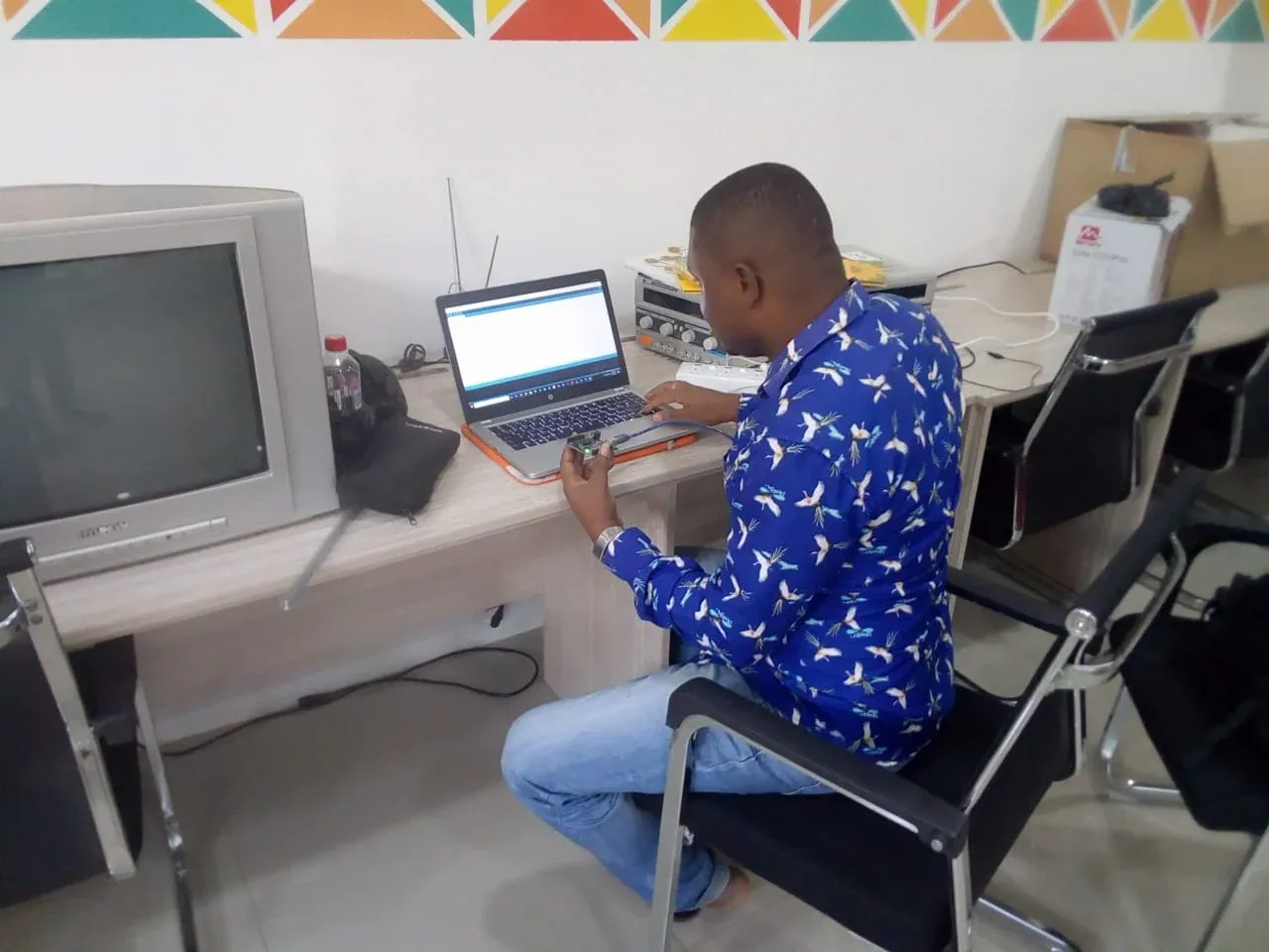 Technician configuring a system from a laptop at a workstation